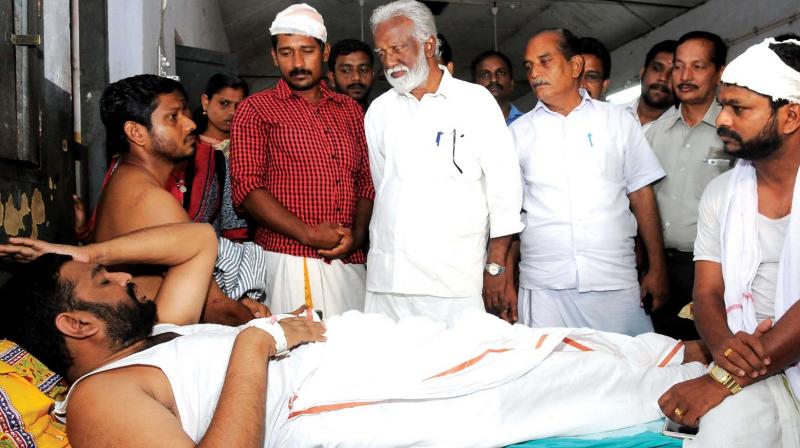 BJP state president Kummanam Rajashekaran and Kottayam district president N. Hari visit party workers at the general hospital in Kottayam on Thursday. (Photo: DC)