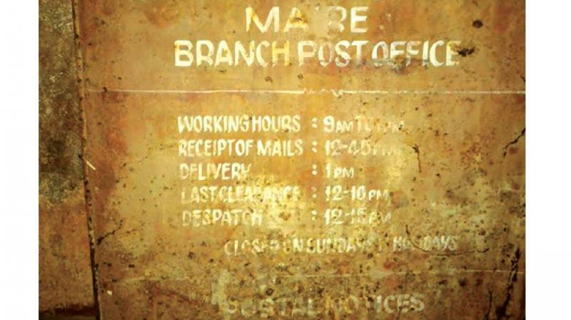 The writing on the post box of Maire Post Office in Kasargod.