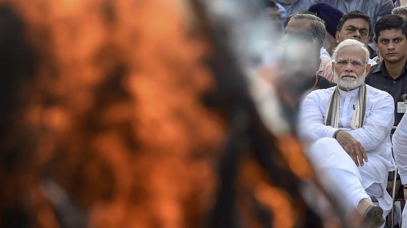 Prime Minister Narendra Modi during the cremation of former prime minister Atal Bihari Vajpayee with full state honour, at Rashtriya Smriti Sthal in New Delhi on Friday, Aug 17, 2018. (Photo: PTI)