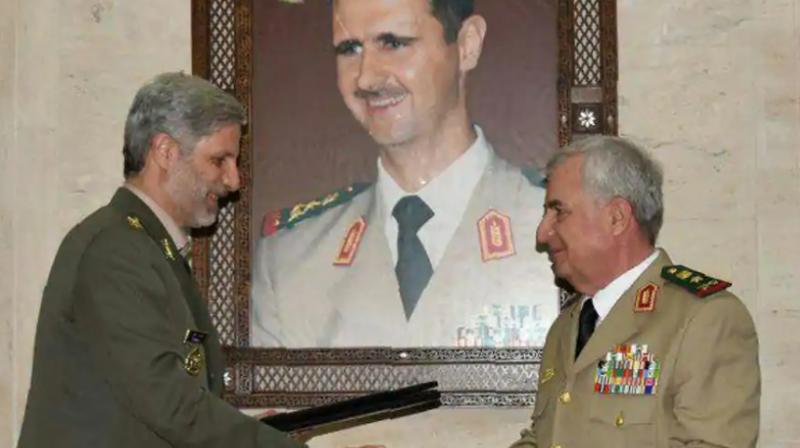Iranian defence minister Amir Hatami (L) meeting with his Syrian counterpart Abdullah Ayoub (R) in the capital Damascus. Iran and Syria signed a deal for military cooperation in a meeting between the defence ministers of the two countries in Damascus, Iranian media reported on Monday. (Photo: AFP)