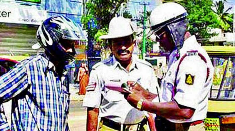 The e-challan system of the city traffic police has failed to create fear among errant motorists in Vizag and is instead indirectly helping the postal department in earning revenue through delivering the traffic e-challans to motorists. (Representational image)