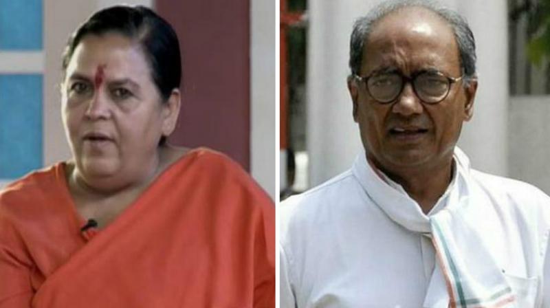 Union Water Resources Minister Uma Bharti and Congress leader Digvijaya Singh. (Photo: PT