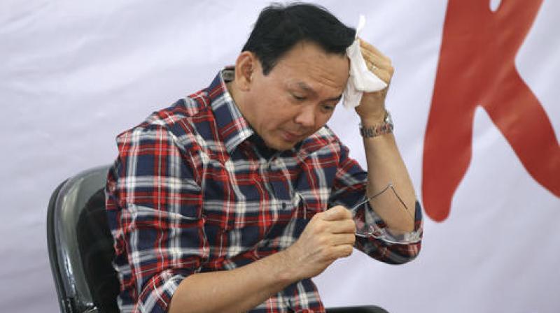 Police said the allegations against Basuki Tjahaja Purnama, who is also the first member of Indonesias ethnic Chinese minority to lead Jakarta, should go to trial and ordered him not to leave the country. (Photo: AP)