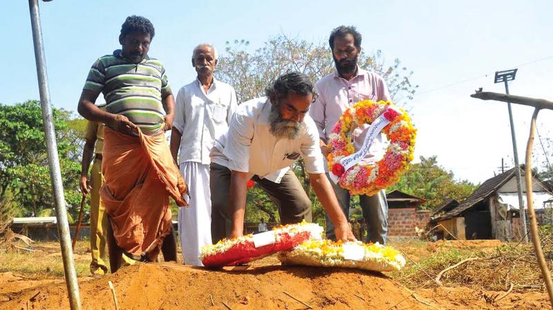 Human rights activists Grow Vasu, Bhagavat Singh and Thushar Nirmal Sarathy paying last respects to Ajitha who was buried at West Hill creamatorium on Saturday. (Photo: DC)