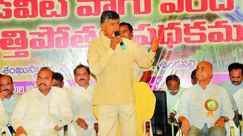 Chief Minister N. Chandrababu Naidu speaks at the foundation-laying ceremony of Kondaveeti Vagu floodwater lift scheme at Undavalli in Guntur district on Wednesday. Minister for agiculture P. Pulla Rao and Guntur MP Galla Jaydev are also seen. (Photo: DC)