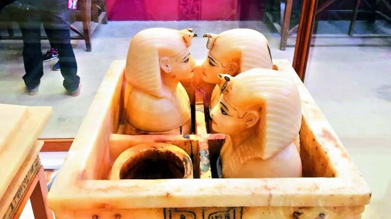 Canopic jars where Tutankhamuns viscera were reportedly kept.  The dark spots are believed to be his blood.