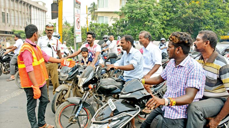 The 17-year-old boy is seen regulating traffic near Ega theatre traffic junction in Chennai on Saturday.  (DC)