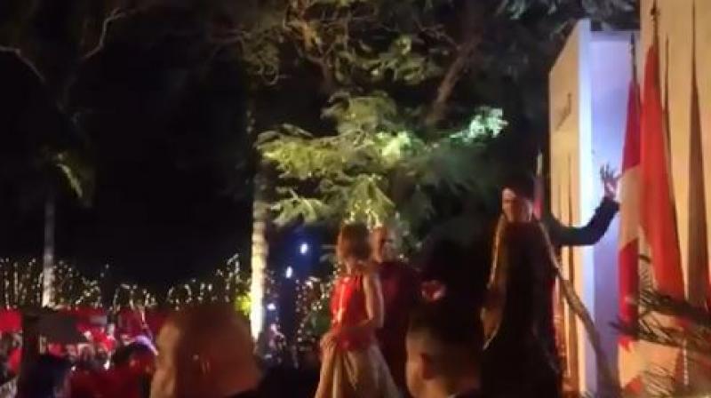 Dressed in black shervani and golden duppata, Canadian PM Justin Trudeau accompanied by wife Sophie Trudeau danced to the beats of dhol at a venue which was decorated much like a big, fat Indian wedding. (Photo: Screengrab)
