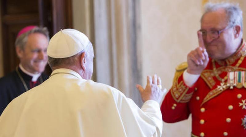 In this June 25, 2015 file photo, Pope Francis greets the Grand Master of the Sovereign Order of Malta Matthew Festing, right, at the end of a private audience in the Pontiffs private library at the Vatican. (Photo: AP)