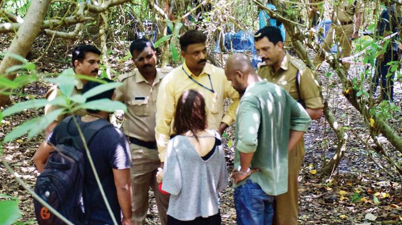 Police officials talk to Ligas sister Ilze Skormane after the headless body was found at Vazhamuttom in Thiruvananthapuram on Saturday. (Photo: DC)