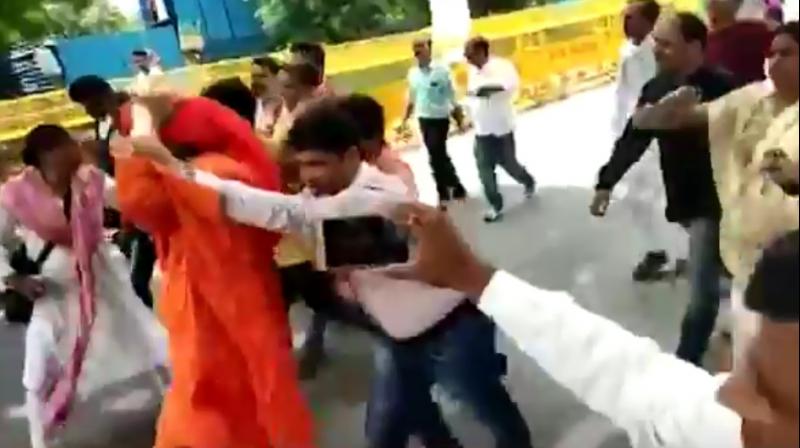 In a video that circulated on social media, the social activist is seen being chased and pushed by a group of people as he keeps walking and trying to get away. (Youtube Screengrab)