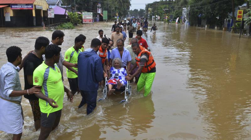 An elderly woman is evacuated towards safer area in Thrissur, in the southern Indian state of Kerala. (Photo: AP)
