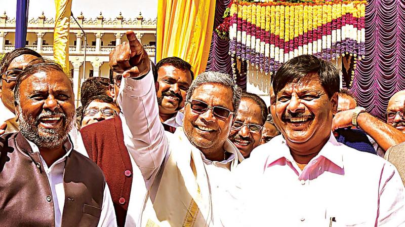 CM Siddaramaiah with ministers H.C. Mahadevappa and Anjaneya at unveiling of Dr B.R. Ambedkars statue in front of Vidhana Soudha in Bengaluru on Saturday. (Photo: DC)