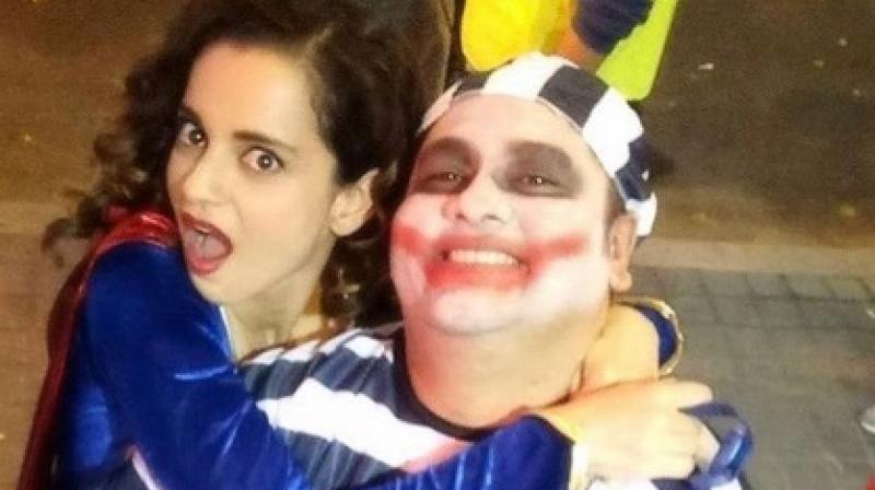 Kangana Ranaut is seen here in a somewhat wacky costume with her Gujarati trainer Suraj Vyas.