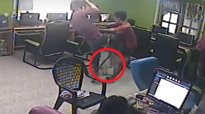 After the man kicked and jumped about, the snake slithered away but the scared friends stood on chairs to protect themselves. (Photo: Youtube)