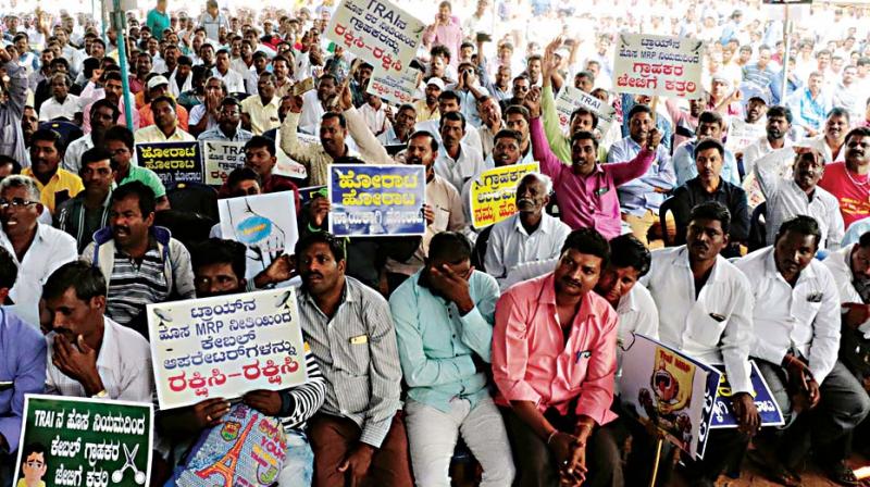 Members of Karnataka State Cable TV Operators Association stage a protest against Telecom Regulatory Authority of Indias revised tariff order for TV channels, at Freedom Park in Bengaluru on Friday  (Photo: KPN)