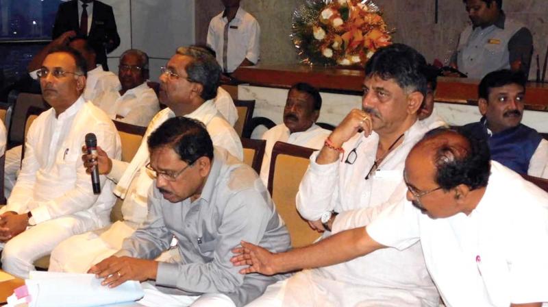 Congress leaders Dinesh Gundurao, Siddaramaiah, G. Parameshwar, D.K. Shivakumar and M Veerappa Moily at the CLP meeting in Bengaluru on Tuesday 	 DC