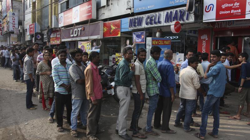 As banks were closed on Sunday, people rushed to ATMs for cash withdrawal where long queues were seen at some places in Mumbai. (Photo: PTI/File)