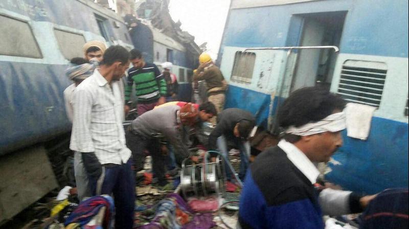 Rescue officials on the spot where 14 coaches of the Indore-Patna express derailed, killing more than 90 passengers. (Photo: PTI)