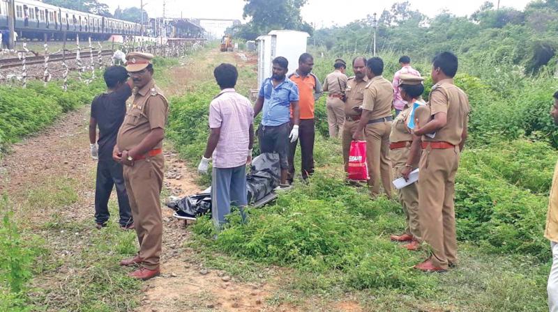 Police remove body of a woman, found murdered near Potheri railway station, on Tuesday. (Photo: DC)