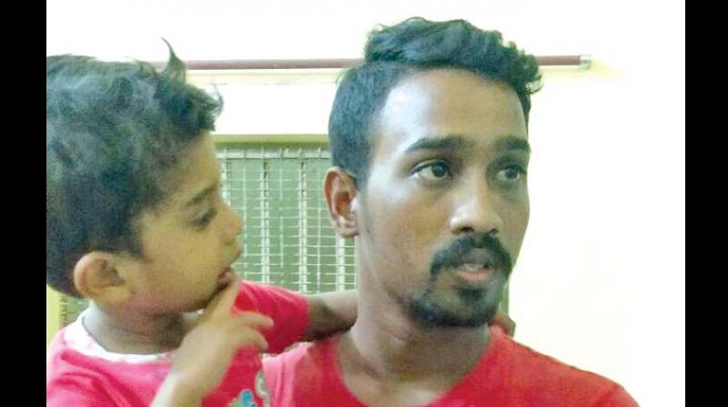 Mohammed Sathu with his father. (Photo: DC)