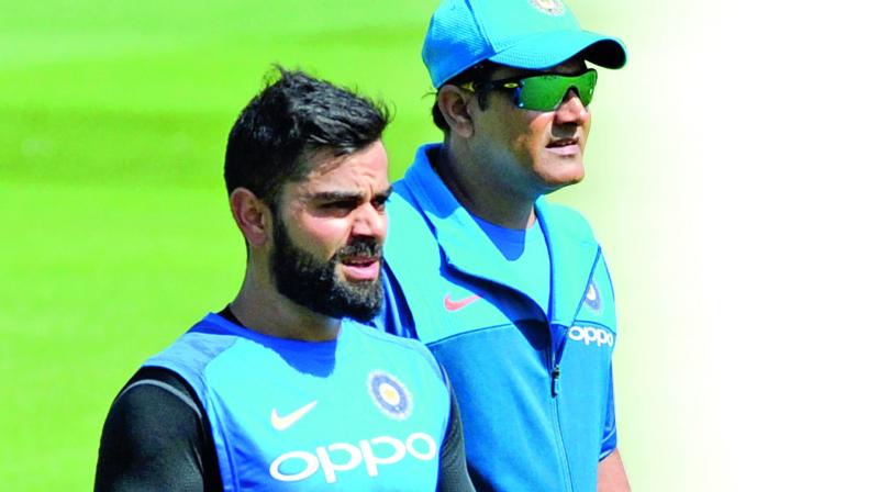 Virat Kohli and Anil Kumble during a  training session. (Photo: AP)