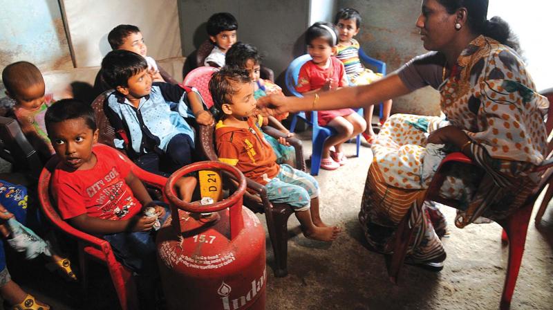 The 50 sq-ft single room anganwadi on the roadside at Vennala which is in a bad shape posing threat to the lives of students and the teacher. LPG cylinders and gas stoves are also kept in the same room. (Photo: ARUNCHANDRA BOSE)