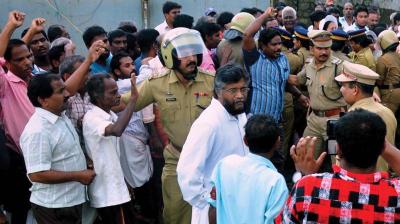 Police removes residents who, under the banner of Puthuvypeen LPG Terminal Virudha Janakeeya Samara Samithi, are agitating against the construction of IOC LPG terminal in Kochi on Wednesday (Photo: DC)