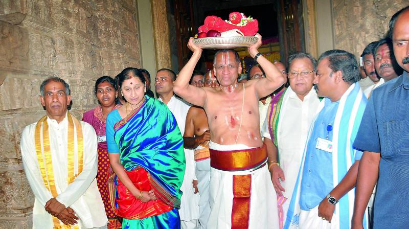 Governor E.S.L. Narasimhan carries silk clothes and pearls for the celestial marriage of Lord Sri Rama at Vontimitta temple in Kadapa on Monday. (Photo: DC)