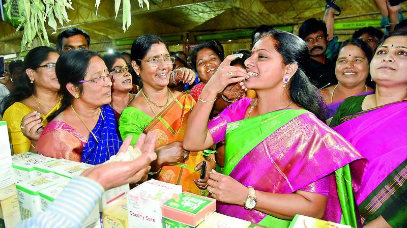 MP Kalvakuntla Kavitha tasting the organic food at the Women of India Organic Festival at Shilparamam.