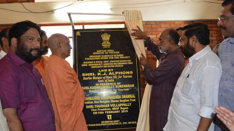 Union minister of state for tourism K. J. Alphons unveils the plaque of the Sivagiri Pilgrimage Circuit at Sivagiri Mutt in Varkala on Sunday. Also seen are state tourism minister Kadakampally Surendran, A. Sampath,MP, V. Joy,MLA and  Sree Narayana Dharma Sangham Trust president Swami Vishudhananda.
