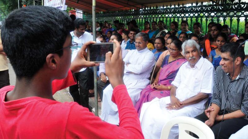 Former Chief Minister Oommen Chandy stage a sit-in, in front of the Secretariat in solidarity with special needs students, parents and teachers demanding aided category to special schools (File pic October, 2017)