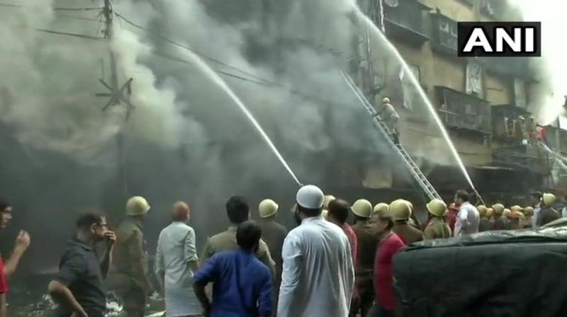 Fire fighters are still trying to contain the massive fire at Bagri market in Canning Street. (Photo: ANI/Twitter)