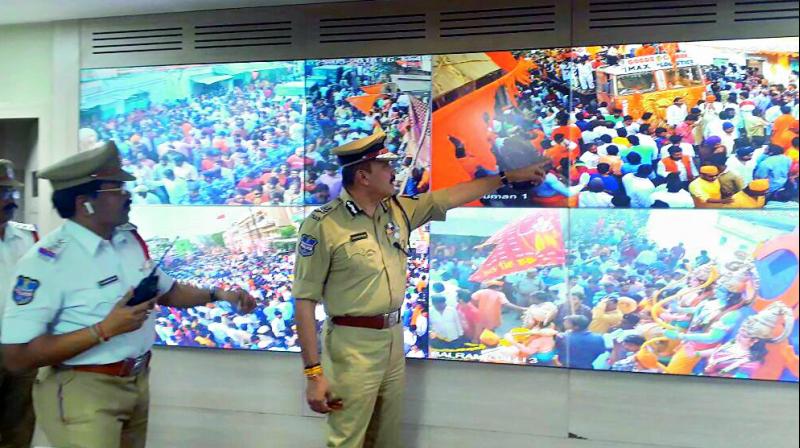 Police keep tab of CCTV footage of the Rama Navami procession taken out in the city on Sunday.