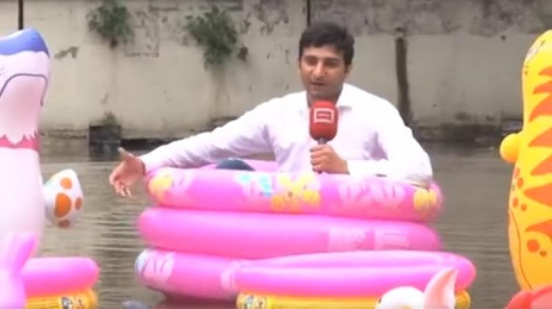 He further said he is \enjoying in water pool\ and recommended the locals to do the same \as the water was not going to recede anytime soon.\ (Photo: Dunya News/ ANI)