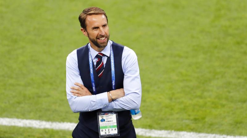 England head coach Gareth Southgate smiles as he walks on the pitch before the round of 16 match between Colombia and England at the 2018 soccer World Cup in the Spartak Stadium, in Moscow, Russia. (Photo: AP)