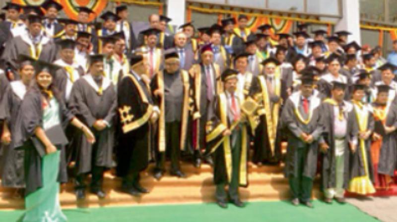 Nalsar graduates pose for photographs during their convocation ceremony on Saturday. 	DC
