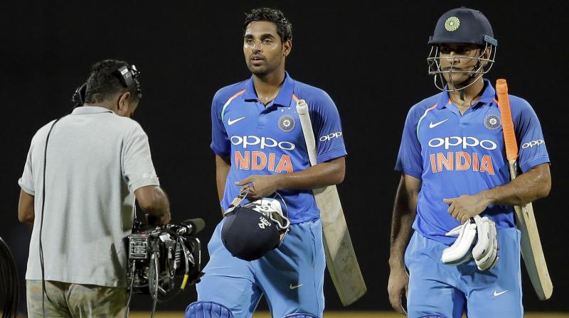 Bhuvneshwar scored 53 and raised an enbeaten 100-run partnership with Dhoni to guide India to a three-wicket win.