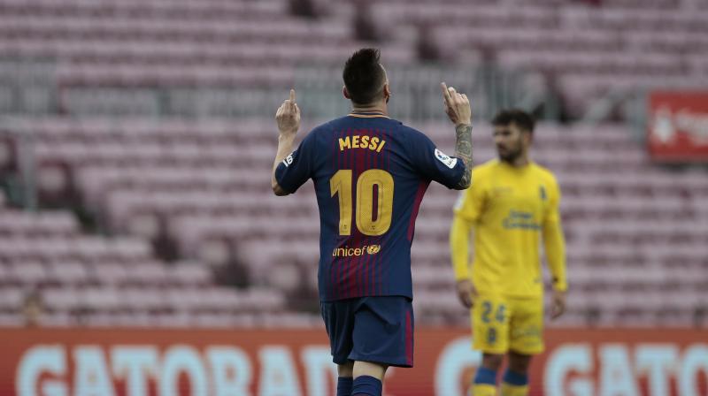Messi added his goals seven minutes apart toward the end of the game at the empty Camp Nou. (Photo:AP)