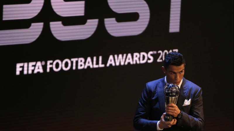 Christiano Ronaldo holds the Best FIFA Mens player award during The Best FIFA 2017 Awards at the Palladium Theatre in London. (Photo:AP)