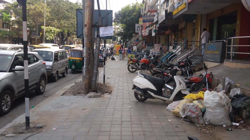 Vehicles parked on a footpath at Sarakki Junction 	(Photo: DC)