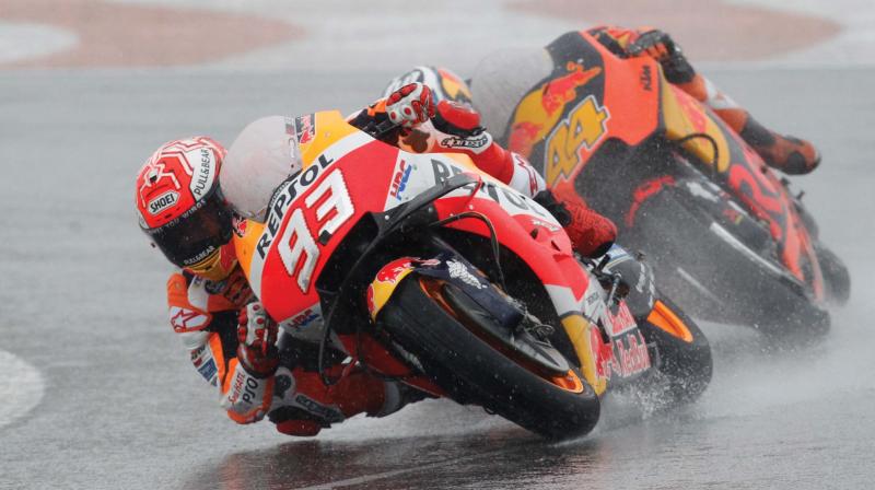 Honda rider Marc Marquez leads KTMs Pol Espargaro during the Motorcycle Grand Prix at the Ricardo Tormo circuit in Cheste near Valencia on Sunday.	(Photo: AP)