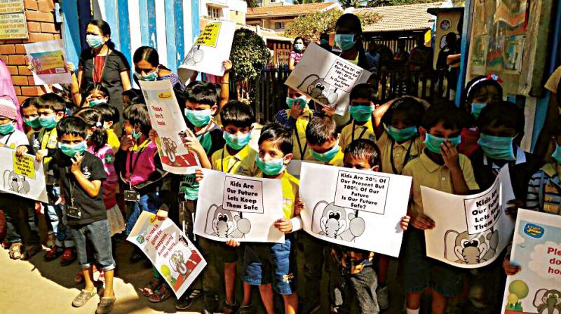 Children take part in a protest organised by Nallurahalli Rising and Whitefield Rising in Bengaluru on Wednesday. (Photo: DC)