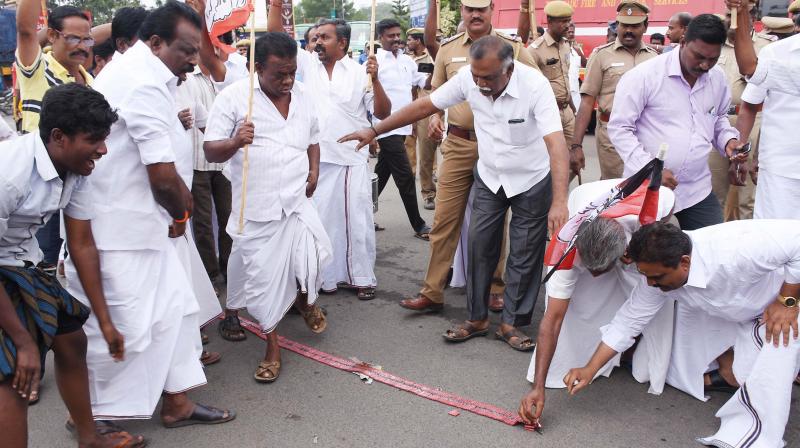OPS supporters burst crackers near Periyar bus stand after the Supreme Court verdict upholding conviction of V.K. Sasikala in Madurai on Tuesday  (Photo: DC)