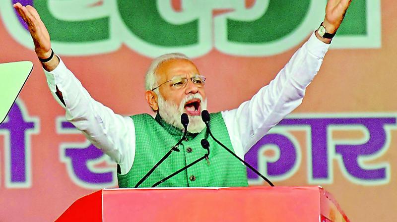 Prime Minister Narendra Modi addresses his supporters during a Sankalp Rally, at Gandhi Maidan in Patna, on Sunday. (Photo: AP)