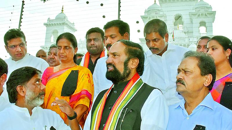 Congress MLAs stage protest wearing black badges outside the Assembly on Sunday, accusing the TRS of poaching MLAs ahead of MLC polls. (Photo: DC)