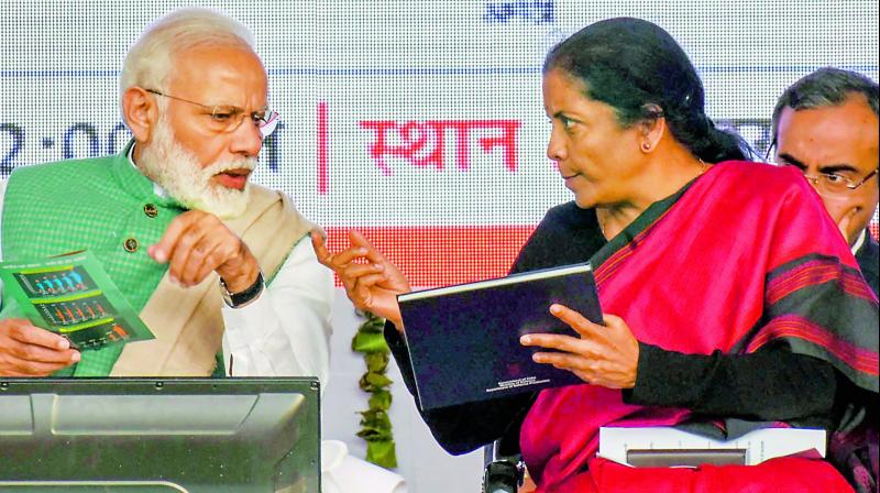 Prime Minister Narendra Modi with Union defence minister Nirmala Sitharaman  during a public rally to launch a Kalashnikov rifles manufacturing facility, in Amethi on Sunday (Photo: AP)