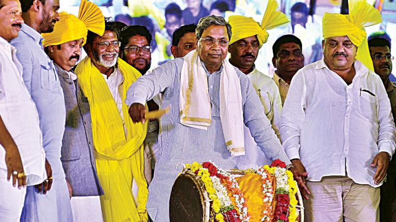 Chief Minister Siddaramaiah launches various programmes at Harapanahalli in Davangere on Tuesday.