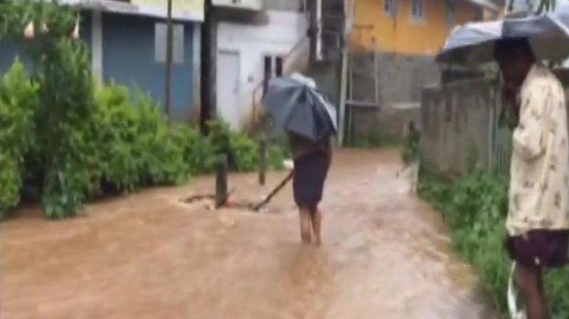 Heavy rainfall in Idukkis Munnar leaves streets flooded, water has entered houses too. (Photo: Twitter/ANI)