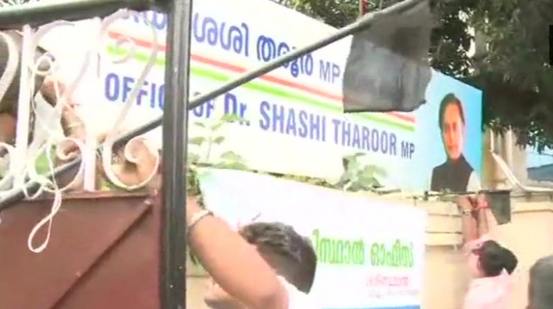 A group of Bhartiya Yuva Morcha activists vandalised Congress MP Shashi Tharoors office Monday. (Photo: Twitter/ANI)